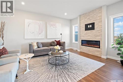 10 Vancouver Crescent, Pilot Butte, SK - Indoor Photo Showing Living Room With Fireplace
