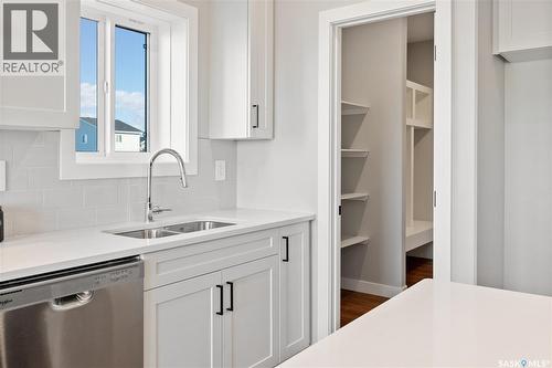 10 Vancouver Crescent, Pilot Butte, SK - Indoor Photo Showing Kitchen With Double Sink