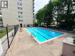 Outdoor swimming pool with integrated lane lines and concrete surround - 