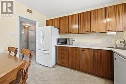 Eat-In Kitchen Offers Convenient Side Yard Access - 