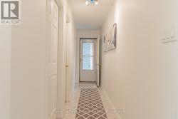 hallway to laundry, bsmt & breezeway garage & deck - 