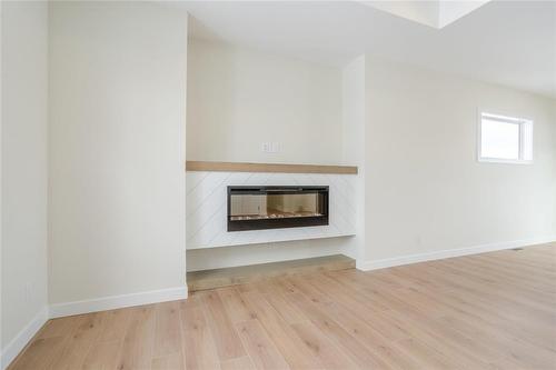 108 Fuller Road, East Selkirk, MB - Indoor Photo Showing Other Room With Fireplace
