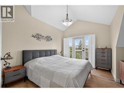 Primary Bedroom Retreat With Vaulted Ceilings And Abundant Natural Light - 