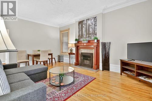 Huge living/dining area with fireplace - 64 Delaware Avenue S, Ottawa, ON 