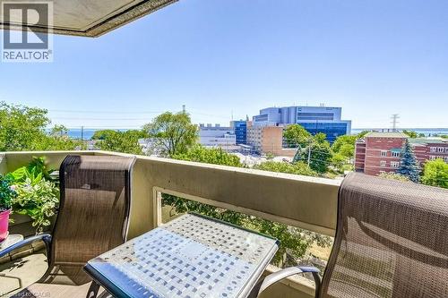 Private balcony with concrete railing, providing elevated outdoor space - 1201 North Shore Boulevard E Unit# 706, Burlington, ON - Outdoor