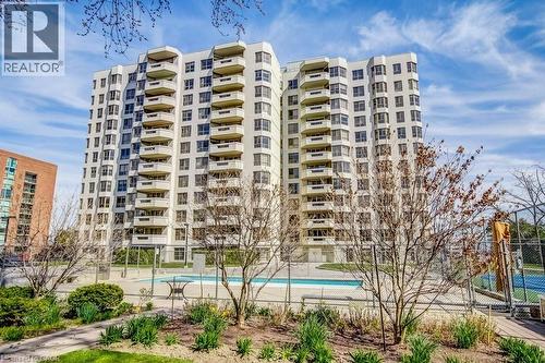 Multi-story residential building featuring numerous private balconies - 1201 North Shore Boulevard E Unit# 706, Burlington, ON - Outdoor With Facade