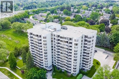 High-rise residential building featuring multiple balconies and a white exterior - 1201 North Shore Boulevard E Unit# 706, Burlington, ON - Outdoor With View