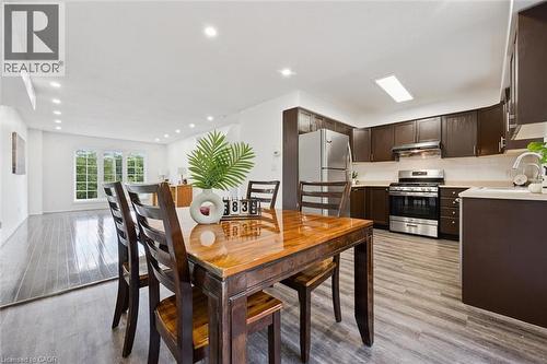 Open-concept interior featuring light wood-finish flooring, recessed lighting, and white walls - 600 White Elm Boulevard Unit# 9, Waterloo, ON 
