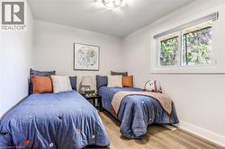 Bright room with wood-finish flooring and white baseboards - 