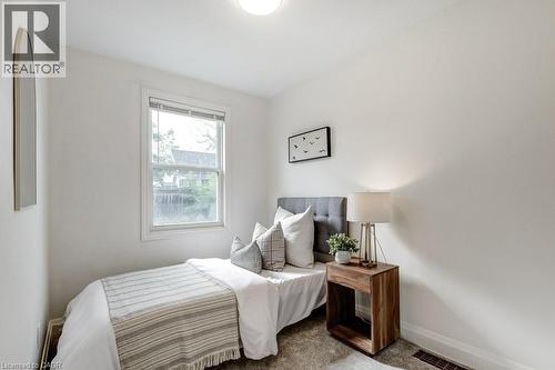 Single-pane window providing natural illumination, complemented by a flush-mount ceiling light - 202 Erindale Avenue, Hamilton, ON 