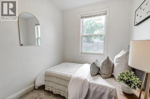 Single window with white trim, light-colored walls, and neutral-toned carpeting - 202 Erindale Avenue, Hamilton, ON 