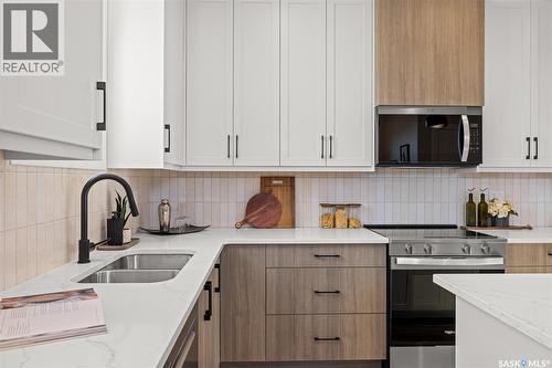 1748 West Market Street, Regina, SK - Indoor Photo Showing Kitchen With Double Sink