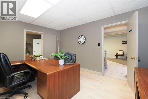Commercial workspace featuring light wood-finish flooring, neutral-toned walls, and recessed ceiling lighting - 731 King Street E, Cambridge, ON 