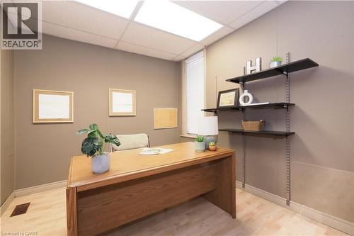 Recessed lighting, wood-finish flooring, a window with blinds, and built-in adjustable shelving - 731 King Street E, Cambridge, ON 