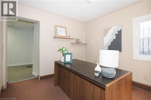 Carpeted room with light-colored paneled walls and a built-in window - 731 King Street E, Cambridge, ON 