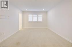 Spare room featuring light carpet and recessed lighting - 