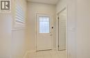 Doorway with tile patterned flooring and baseboards - 302 Jean Landing, Milton, ON 