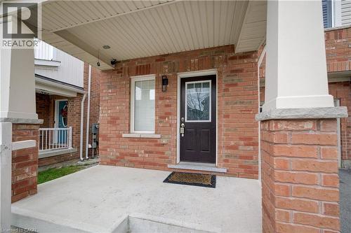 Entrance to property with a porch and brick siding - 302 Jean Landing, Milton, ON 