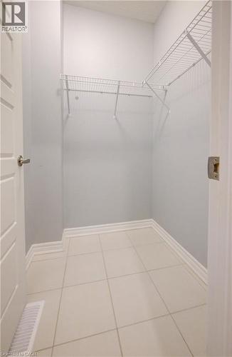 Walk in closet featuring light tile patterned floors - 302 Jean Landing, Milton, ON 