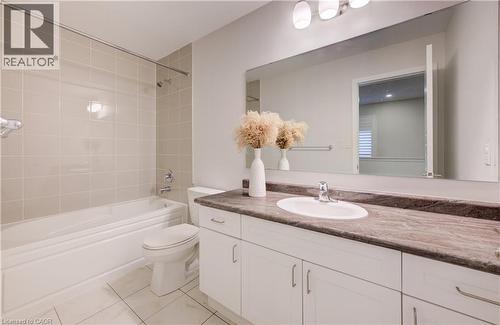 Full bathroom with vanity, shower / bath combination, and light tile patterned floors - 302 Jean Landing, Milton, ON 