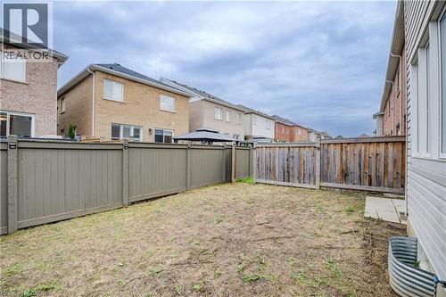 Fenced backyard featuring a residential view - 302 Jean Landing, Milton, ON 