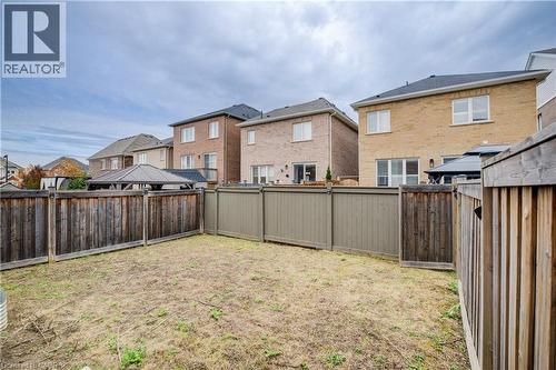 Fenced backyard featuring a residential view - 302 Jean Landing, Milton, ON 