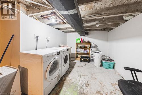 Utility area featuring a concrete floor and exposed wood beam ceiling - 47 Fraser Avenue, Hamilton, ON 