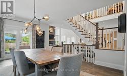 A Hardwood Staircase Leads to the Upper Level - 