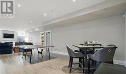 Laminate Flooring Flows Throughout the Basement - 