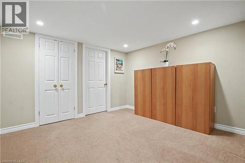 Carpeted room featuring recessed lighting, light-toned walls, and white trim - 4237 Millcroft Park Drive, Burlington, ON 