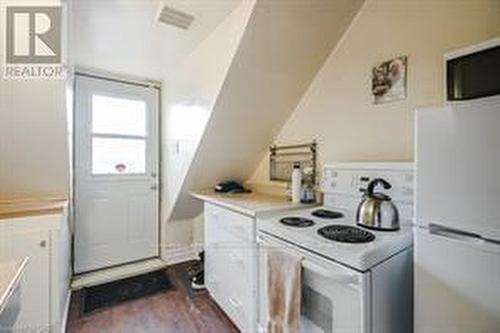 Third floor kitchen with outdoor access to deck. - 270 Queen Street S, Hamilton, ON 