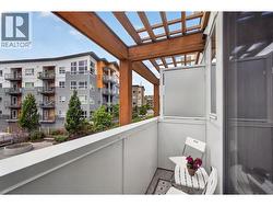 Balcony off the dining area, perfect for letting in a refreshing breeze and enjoying those warm Okanagan days. - 