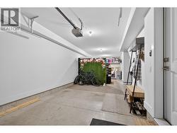 Oversized tandem garage offering plenty of room for vehicles, storage, bikes, outdoor gear, or future flex space such as a home gym or office. - 