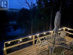 Back Deck overlooking the river at night - 