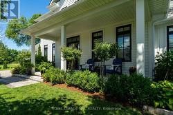 Covered front porch, ideal for enjoyment. - 