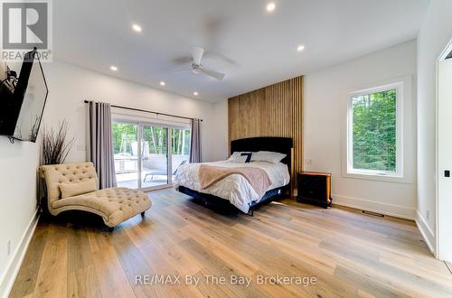 Primary Bedroom with Walk-Out to Hot Tub on Deck - 95 Spruce Street, Tiny, ON 