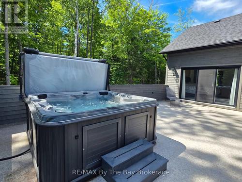 Hot Tub off Primary Bedroom and Living Area - 95 Spruce Street, Tiny, ON 