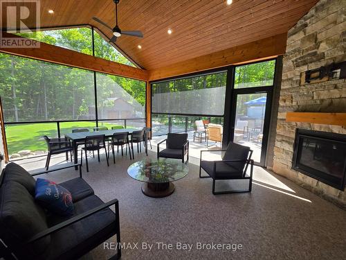 Covered Screened in Porch with Gas Fireplace - 95 Spruce Street, Tiny, ON 