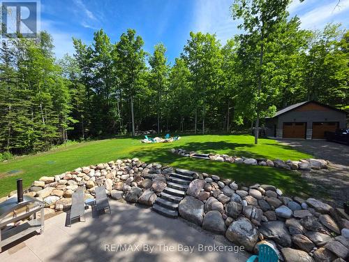 Landscaped Back yard with Fire Pit Area - 95 Spruce Street, Tiny, ON 
