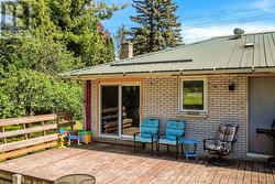 Walk out from kitchen to deck overlooking the yard - 
