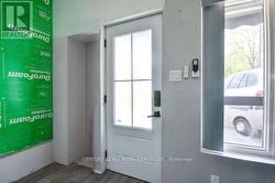 New front entrance and large window. - 