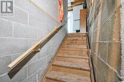 Stairs to shared separate entrance to apartments. - 