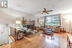 Hardwood floors and wood burning fireplace in LR - 