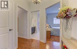 Hardwood-style flooring throughout the hallway - 