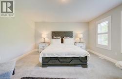Carpeted bedroom with neutral wall tones - 