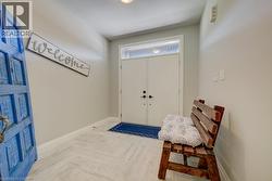 Entryway featuring light wood-finish flooring in a herringbone pattern - 