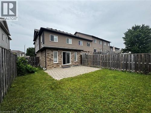 Spacious rear yard featuring a paver patio and ample green space - 13 Sorrento Street, Kitchener, ON - Outdoor