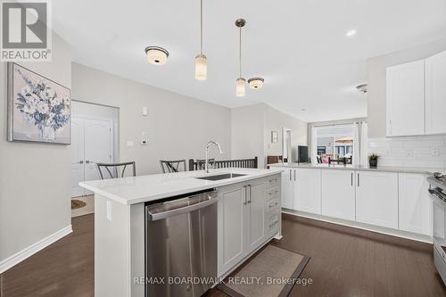 Large Island w/Breakfast Bar & Quartz Counters - 224 Maygrass Way, Ottawa, ON - Indoor Photo Showing Kitchen With Upgraded Kitchen