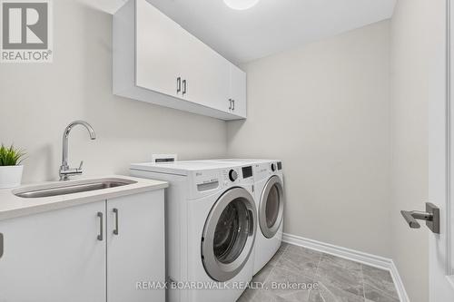Laundry Room w/Built in Cabinets & Sink + Storage - 224 Maygrass Way, Ottawa, ON - Indoor Photo Showing Laundry Room