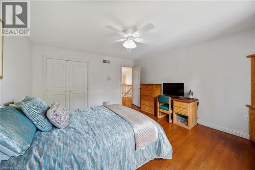 Hardwood flooring, crisp white walls, and a ceiling fan with integrated lighting - 39 Elodia Court, Hamilton, ON 